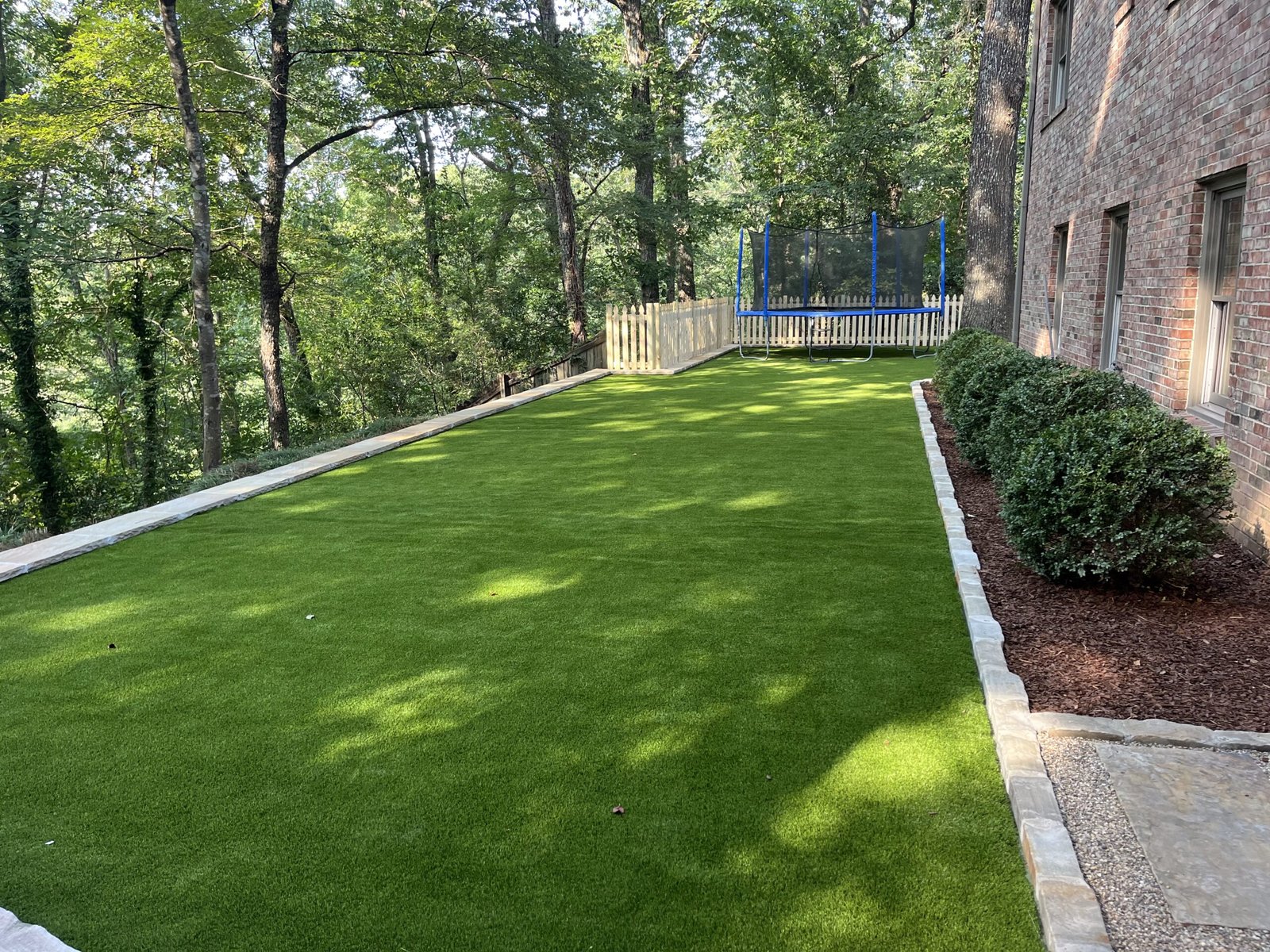 artificial turf installation Birmingham AL backyard with synthetic grass lawn