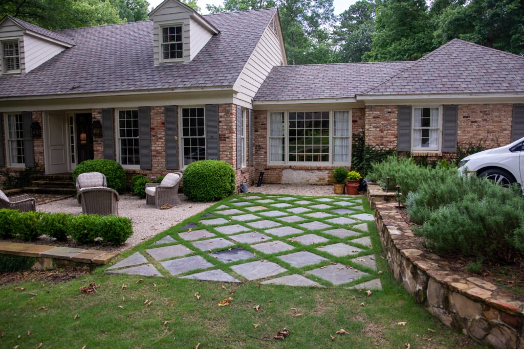 landscape enhancement Birmingham AL backyard transformation with patio and greenery