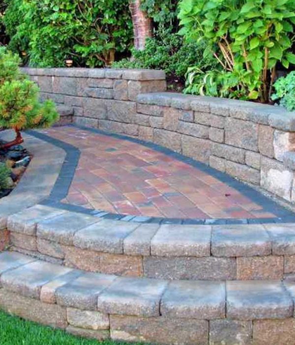 A FARE Outdoor Construction team member working on a hardscape project in Hoover, AL.